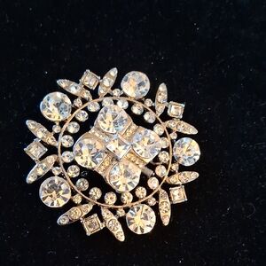 Vintage rhinestone-encrusted circular brooch